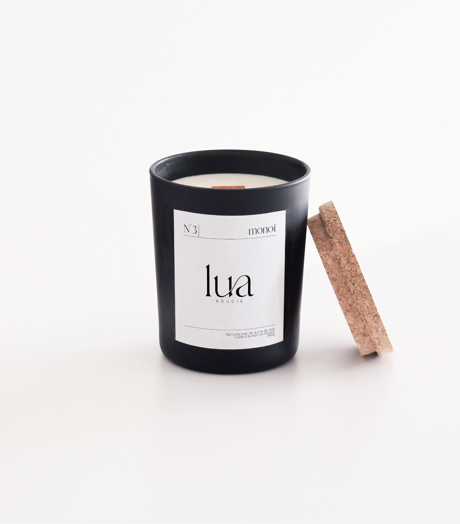 Bougie Lua personnalisables et rechargeables, parfums monoï, contenant noir 180g. 