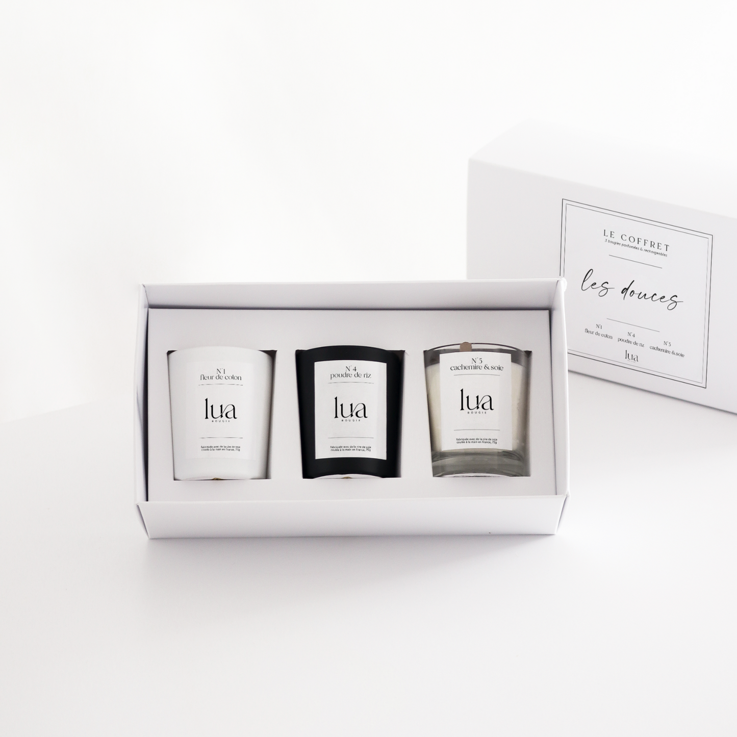Coffret de Noël 3 bougies 75g LUA, couleur de contenant Blanc, Noir et transparents. Parfum de Grasse. 